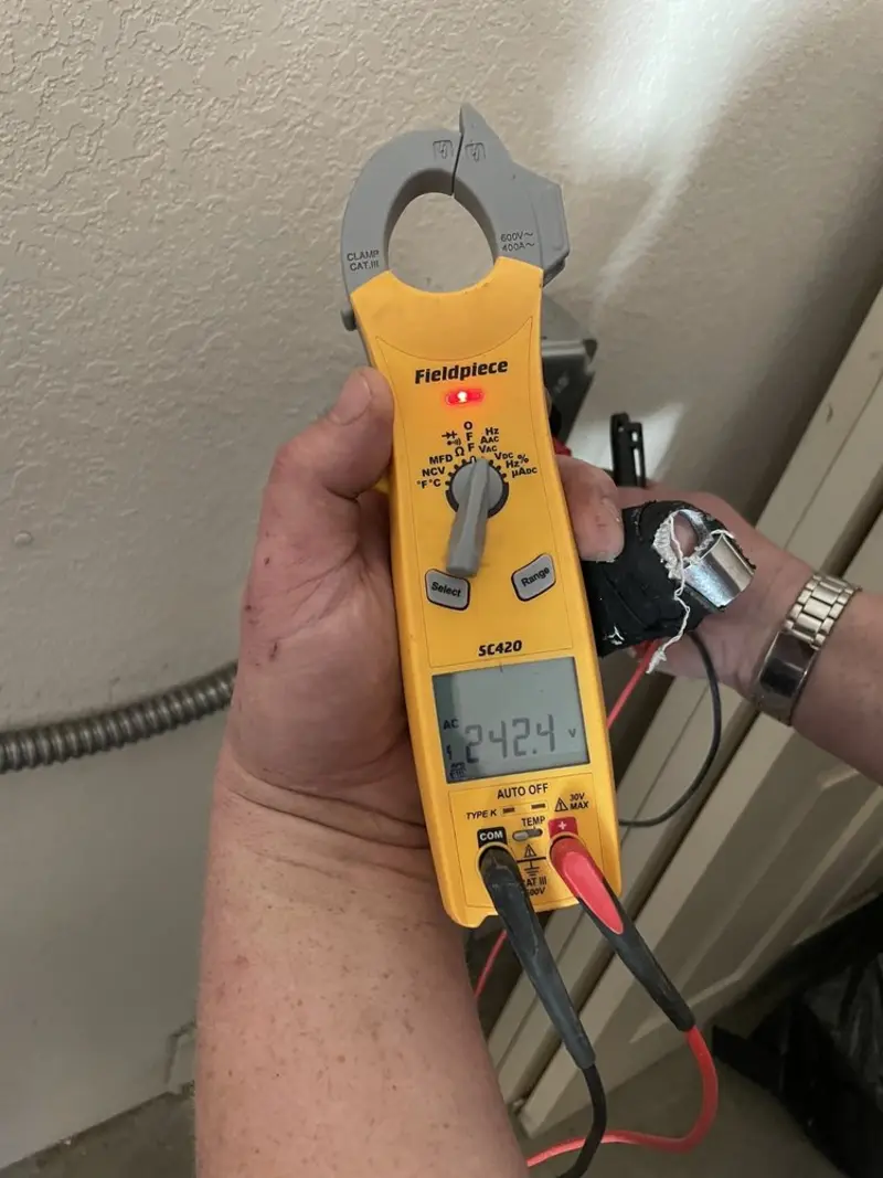 Voltage testing with clamp meter during Whole House Surge Protector in Fishkill